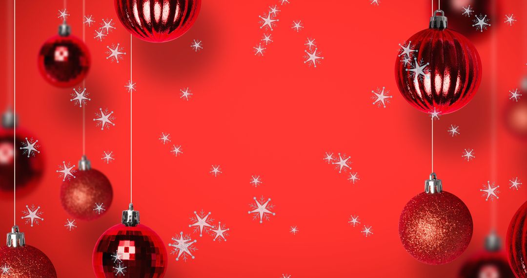 Sparkling Christmas Baubles with Falling Snow on Red Background
