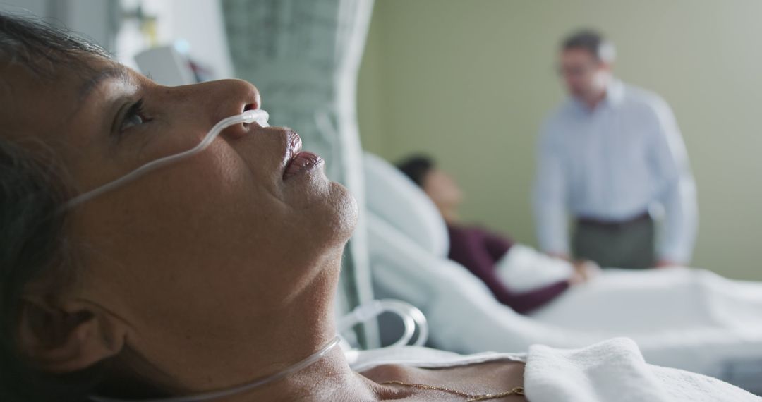 Patient Lying in Hospital Bed With Supportive Visitors - Free Images, Stock Photos and Pictures on Pikwizard.com