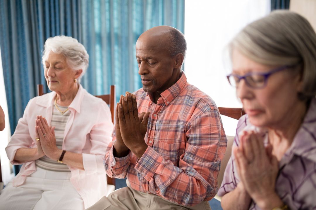 Seniors Praying Together in Retirement Home - Free Images, Stock Photos and Pictures on Pikwizard.com