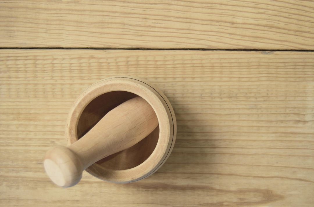 Wooden Mortar and Pestle on Light Wood Surface - Free Images, Stock Photos and Pictures on Pikwizard.com