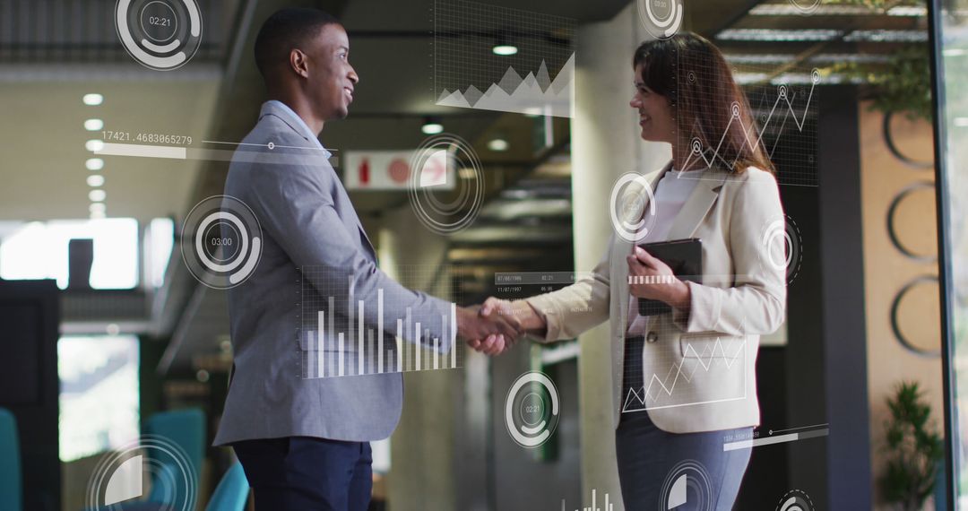 Business People Handshaking with Mixed Reality Data Graphics in Modern Office - Free Images, Stock Photos and Pictures on Pikwizard.com