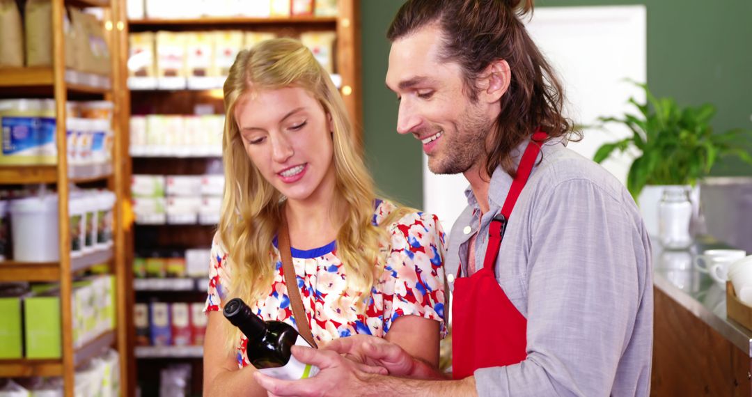 Grocery Store Worker Helping Customer Choose Wine - Free Images, Stock Photos and Pictures on Pikwizard.com