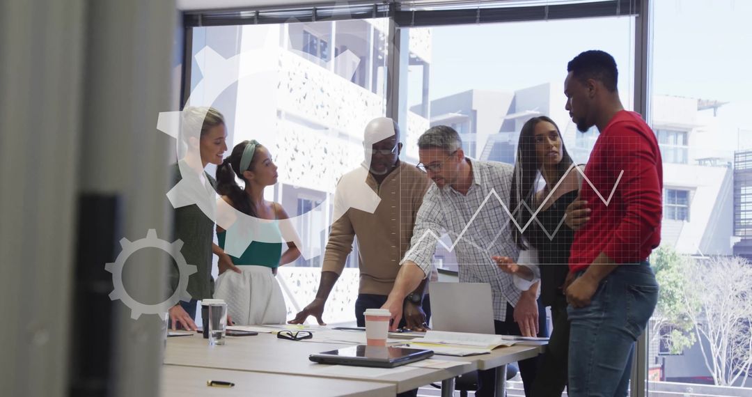 Diverse Team Analyzing Financial Data and Collaborating in Modern Office