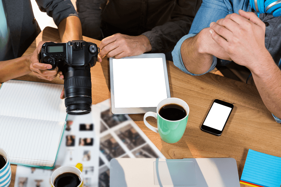 Transparent Workspace with Camera Digital Tablet and Coffee Cups