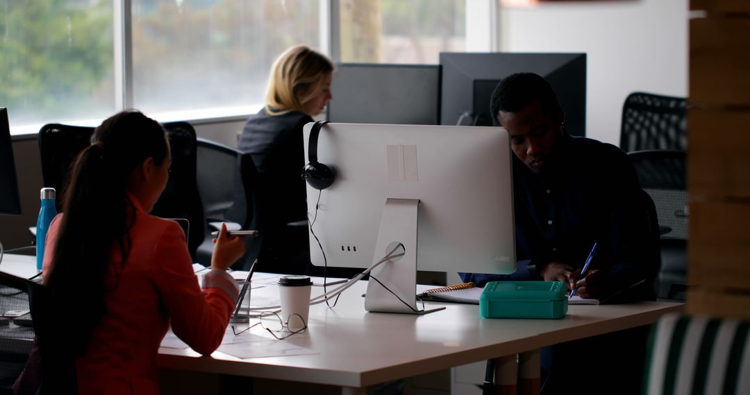 Multicultural Office Team Collaborating at Modern Workspace