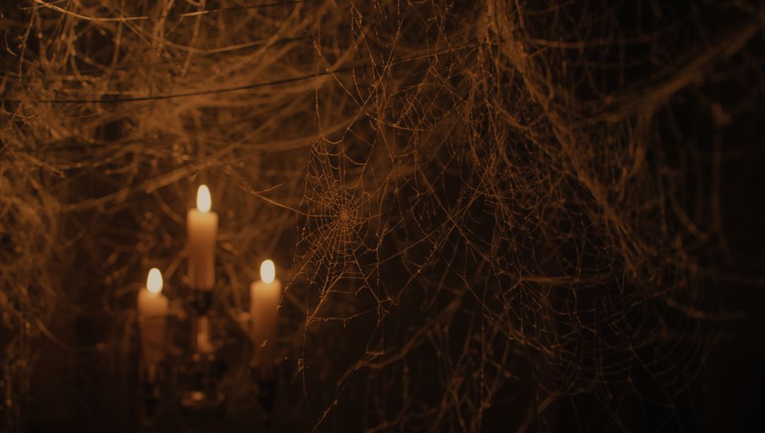 Vintage Candelabra Amidst Dense Spiderwebs in Gothic Setting