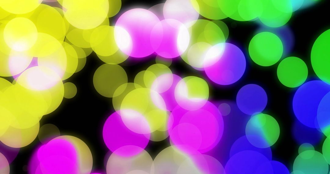 Colorful Spherical Light Bokeh on Black Backdrop