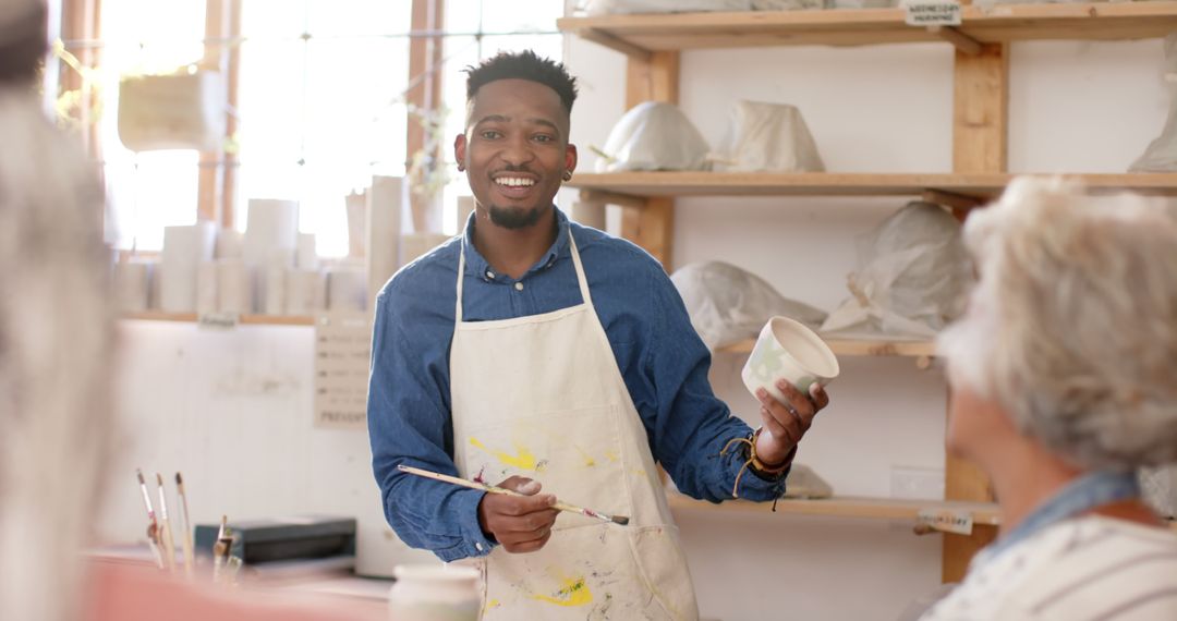 African American Man Instructing in Pottery Class - Free Images, Stock Photos and Pictures on Pikwizard.com