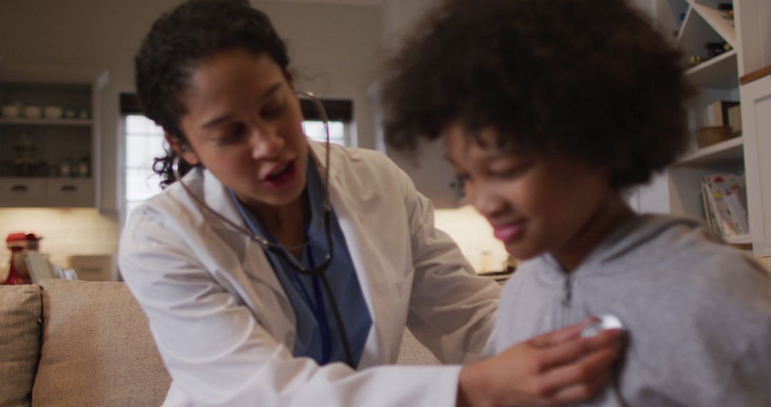 Female Doctor Examining a Child's Heartbeat with Stethoscope at Home - Free Images, Stock Photos and Pictures on Pikwizard.com