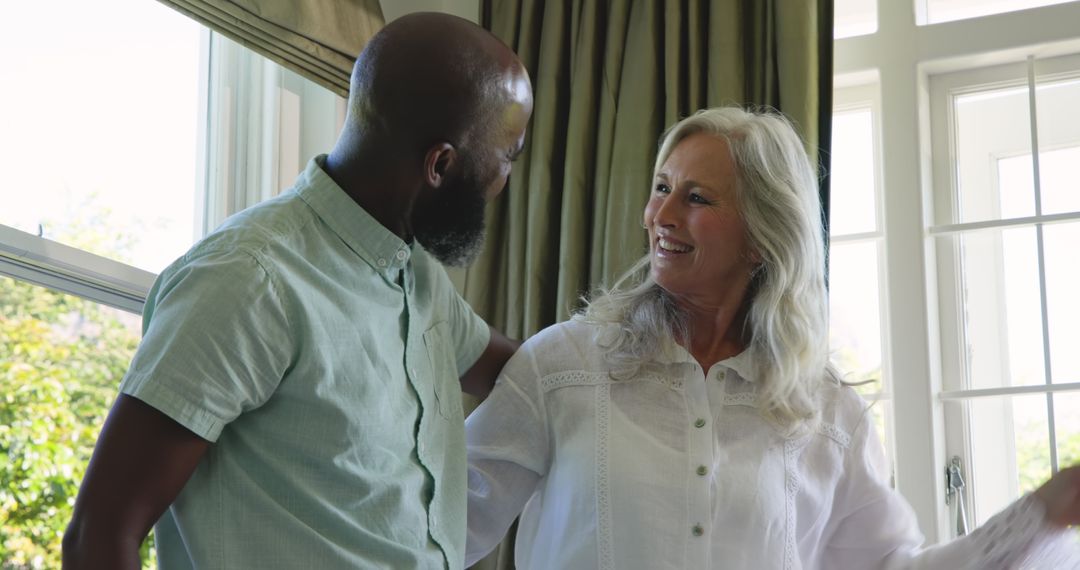 Smiling Multiracial Couple Enjoying Cozy Home Moment
