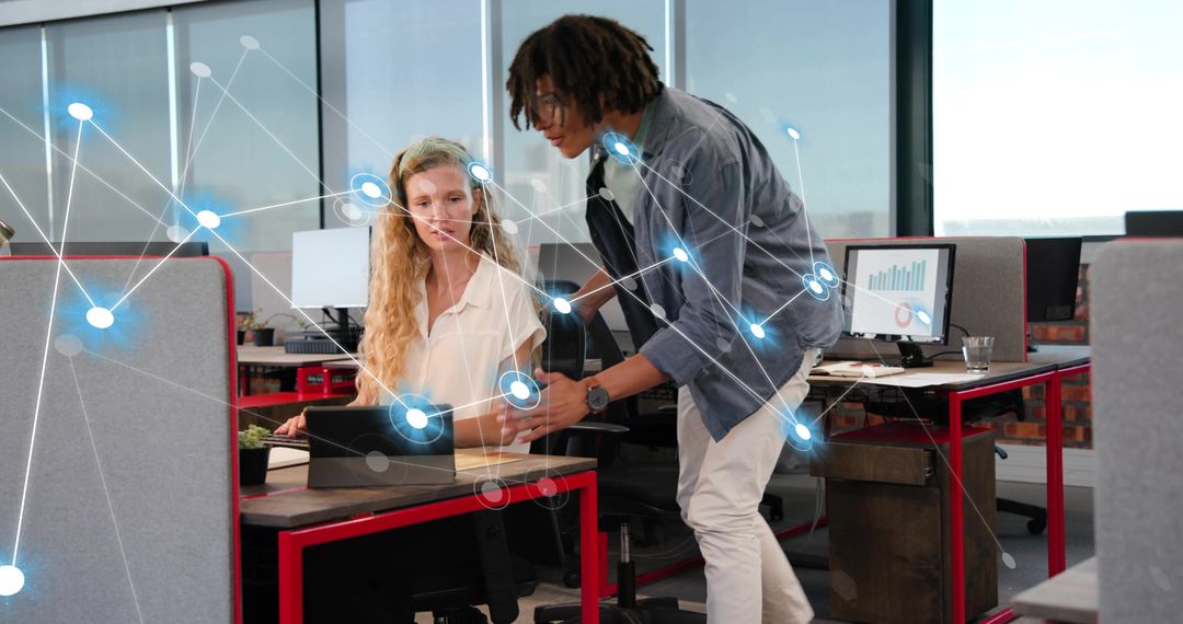 Coworkers Collaborating on Tablet in Open-Plan Office with Digital Network and Analytics