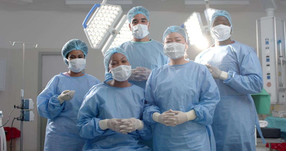 Diverse Medical Team in Surgical Attire in Operating Room - Free Images, Stock Photos and Pictures on Pikwizard.com