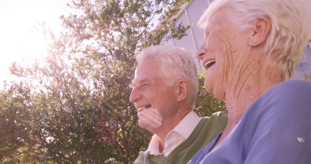 Happy elderly couple enjoying sunny day outdoors - Free Images, Stock Photos and Pictures on Pikwizard.com