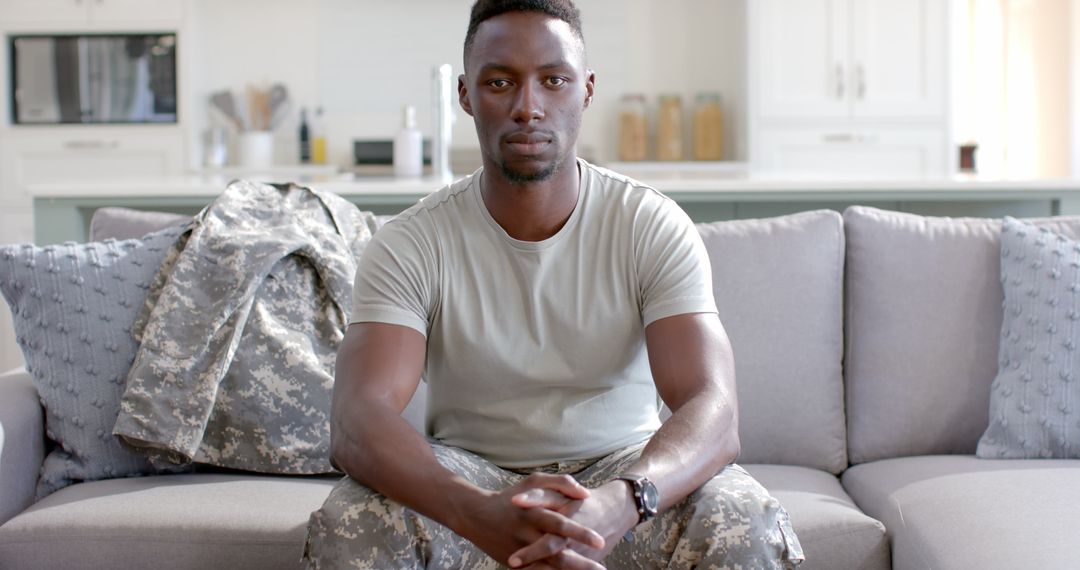 Confident African American Soldier Relaxing at Home After Deployment