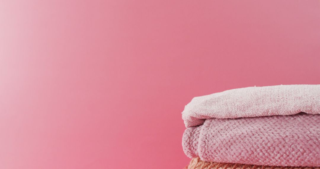Image of folded blankets lying on pink background - Free Images, Stock Photos and Pictures on Pikwizard.com