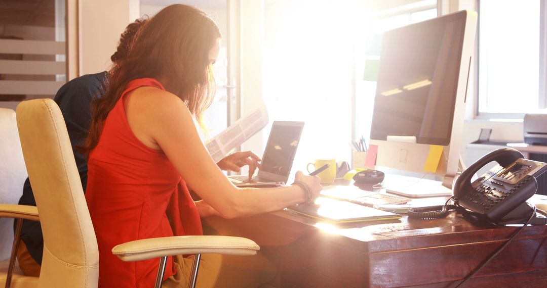 Creative Graphic Designers Collaborating in Sunny Office