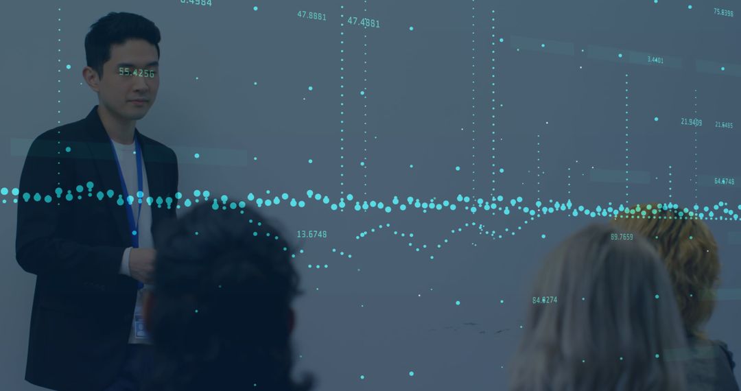 Businessman Delivering Data-Driven Presentation to Colleagues