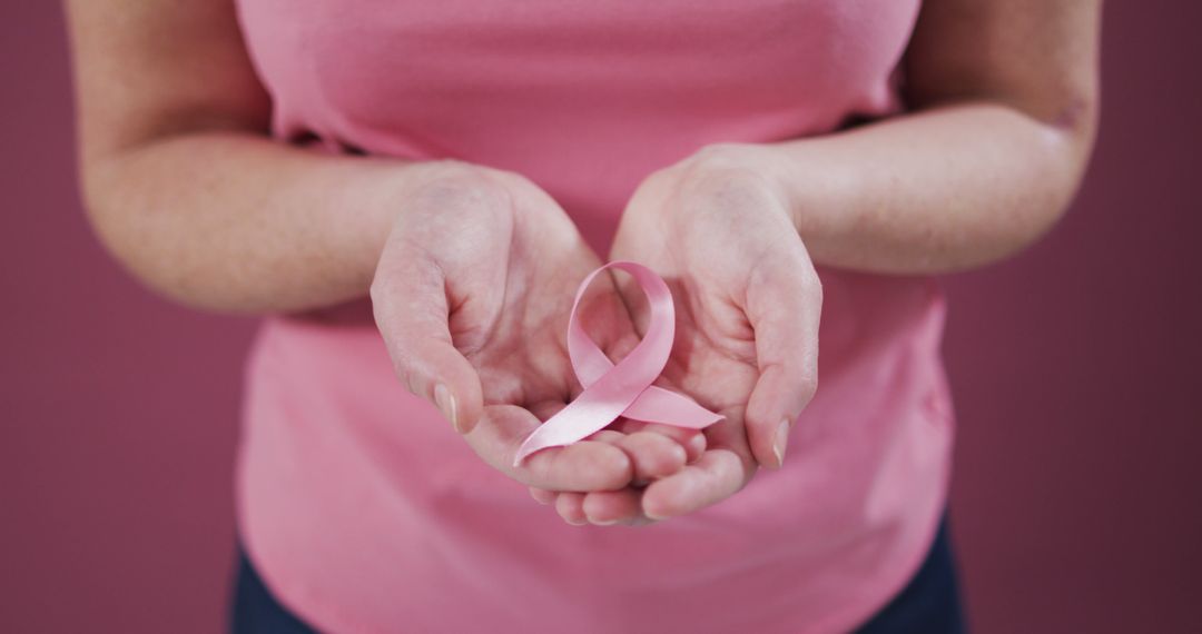 Woman Holding Pink Breast Cancer Awareness Ribbon in Cupped Hands - Free Images, Stock Photos and Pictures on Pikwizard.com