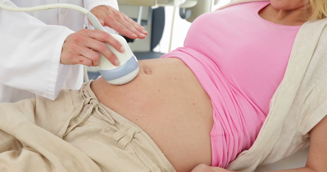 Doctor Performing Ultrasound on Pregnant Woman's Belly - Free Images, Stock Photos and Pictures on Pikwizard.com