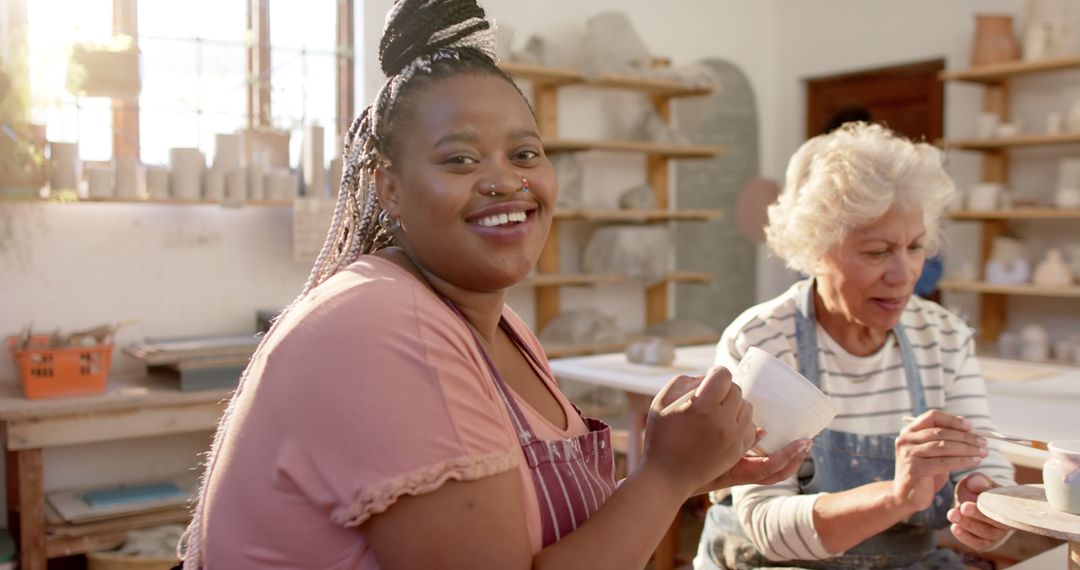 Smiling Women Engaging in Ceramics Crafting Workshop - Free Images, Stock Photos and Pictures on Pikwizard.com