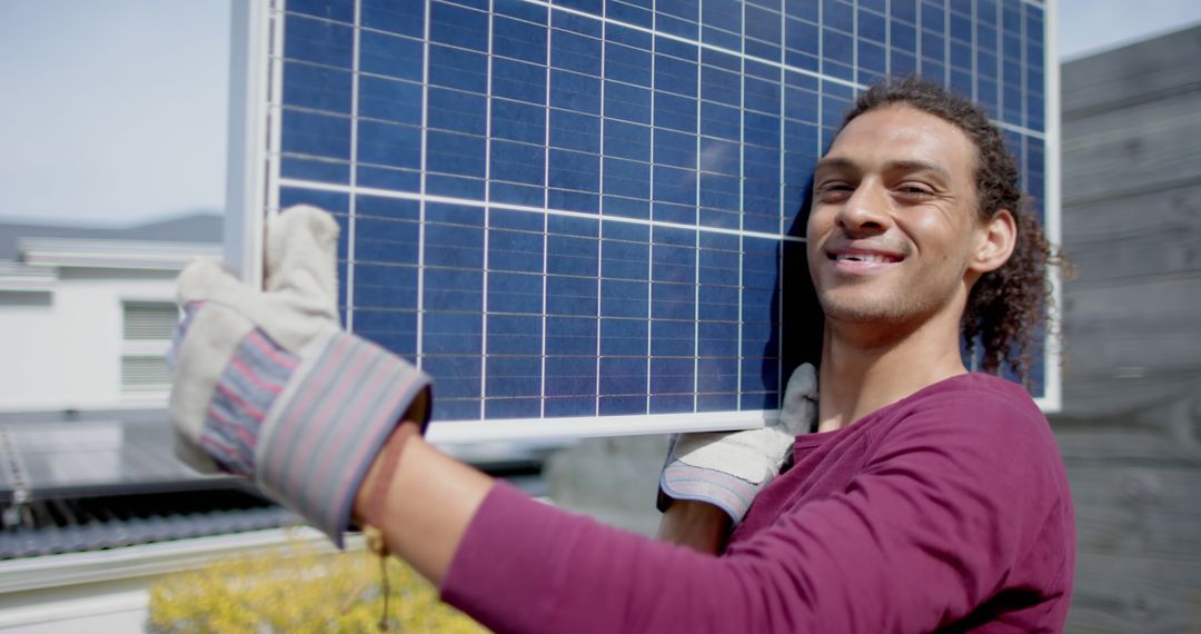 Smiling Man Holding Solar Panel with Gloves - Free Images, Stock Photos and Pictures on Pikwizard.com