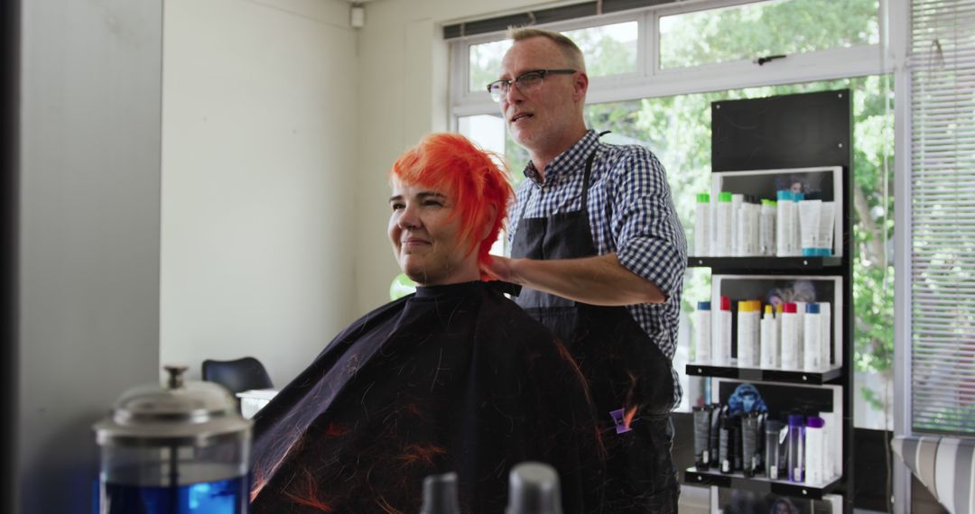 Hairdresser with Apron Dyeing Woman's Short Orange Hair - Free Images, Stock Photos and Pictures on Pikwizard.com