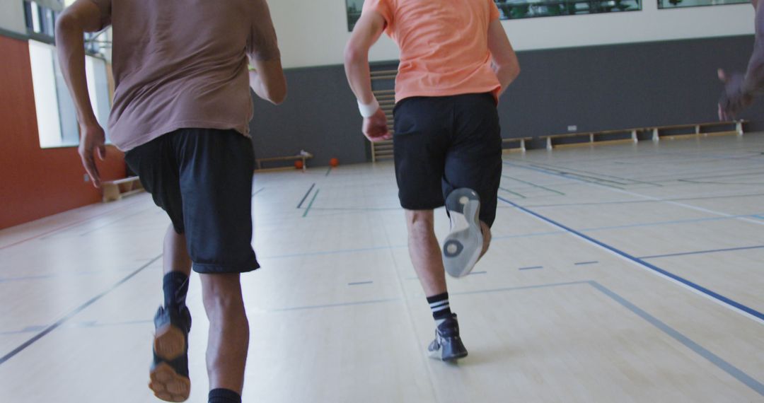 Athletes Running in Indoor Gym - Free Images, Stock Photos and Pictures on Pikwizard.com