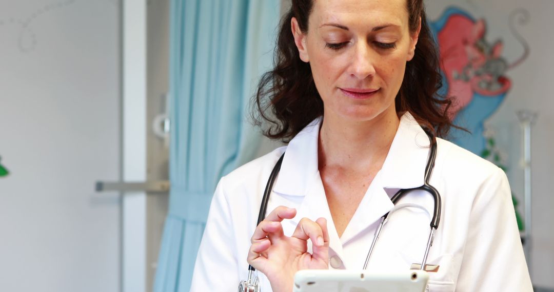 Female Doctor Using Tablet for Patient Management - Free Images, Stock Photos and Pictures on Pikwizard.com