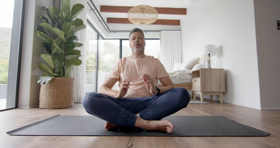 Senior Man Practicing Meditation on Yoga Mat at Home - Free Images, Stock Photos and Pictures on Pikwizard.com