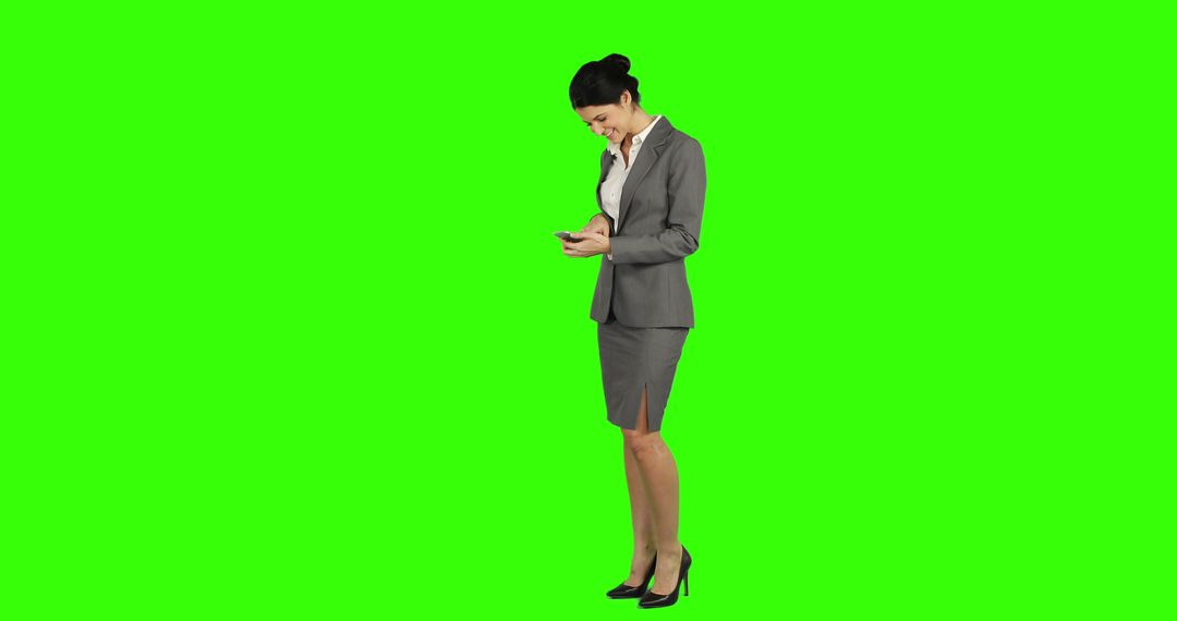 Businesswoman Using Smartphone on Green Screen Background - Free Images, Stock Photos and Pictures on Pikwizard.com