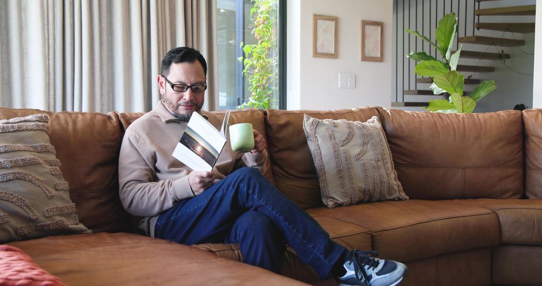 Man Enjoying Cozy Reading Time in Modern Living Room