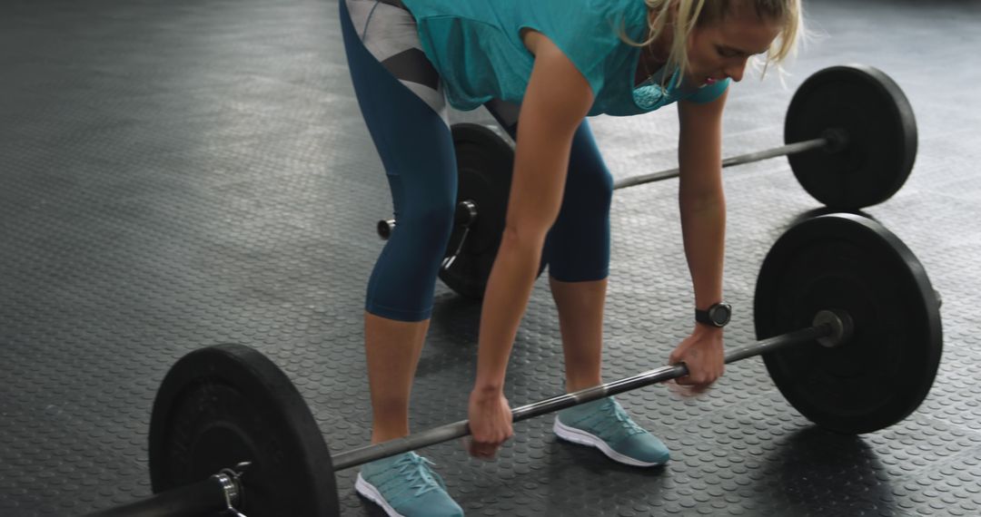 Woman Lifting Barbell in Gym for Strength Training - Free Images, Stock Photos and Pictures on Pikwizard.com