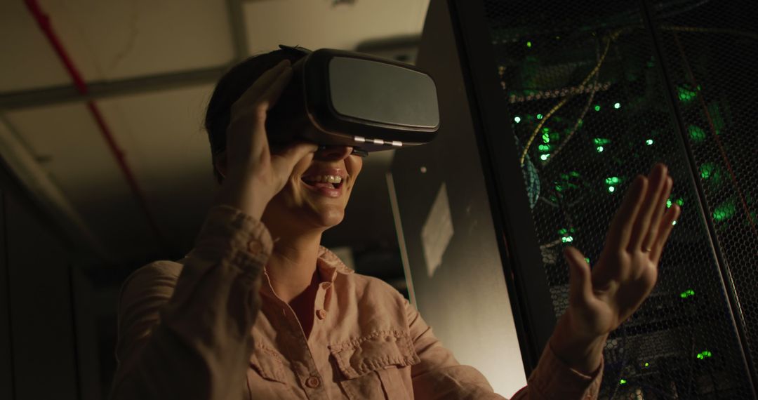 Woman Exploring Virtual Reality in Data Center - Free Images, Stock Photos and Pictures on Pikwizard.com