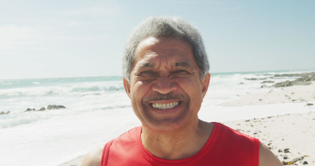 Smiling Senior Man Enjoying Sunny Beach