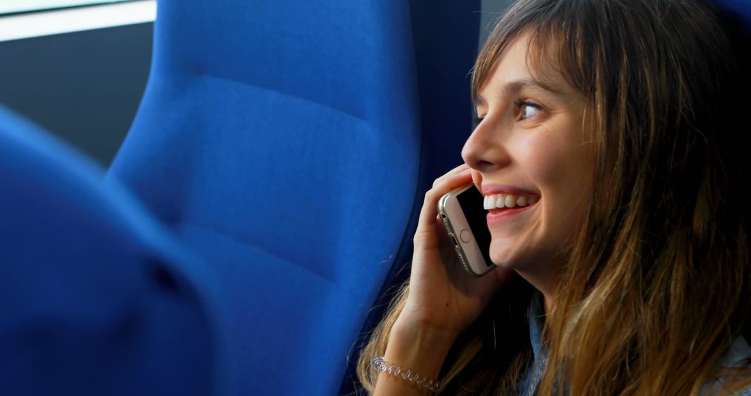 Young Woman Smiling While Talking on Smartphone - Free Images, Stock Photos and Pictures on Pikwizard.com