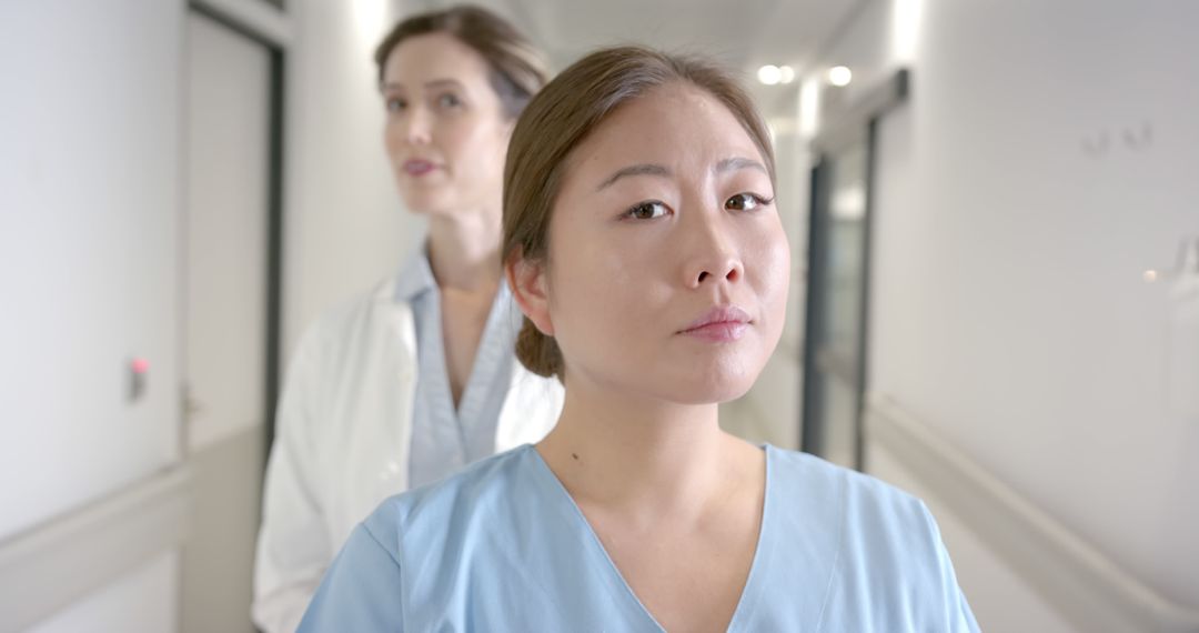 Determined Healthcare Professionals in Hospital Corridor - Free Images, Stock Photos and Pictures on Pikwizard.com