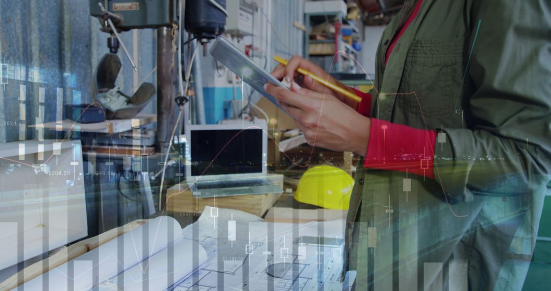 Female Engineer Using Tablet for Planning at Workshop