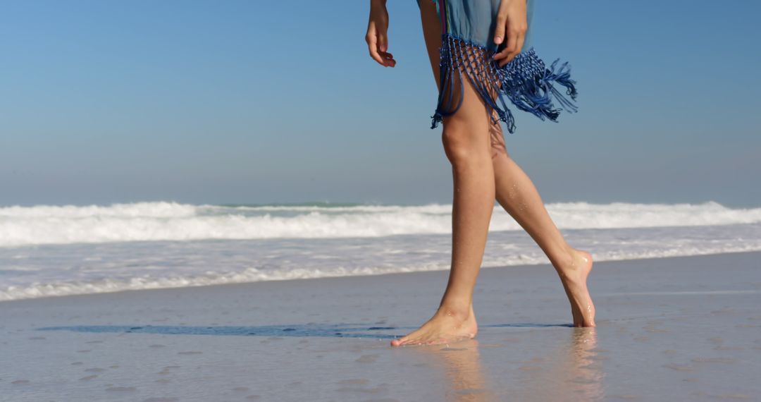 Person walks barefoot on the beach, with copy space - Free Images, Stock Photos and Pictures on Pikwizard.com
