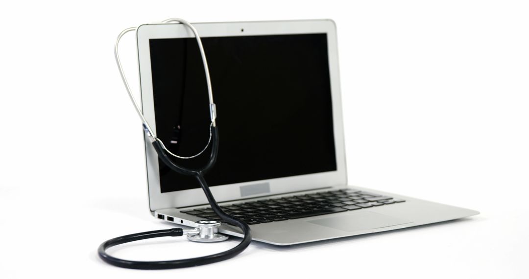A stethoscope on a laptop signifies the rise of telemedicine for remote healthcare. - Free Images, Stock Photos and Pictures on Pikwizard.com