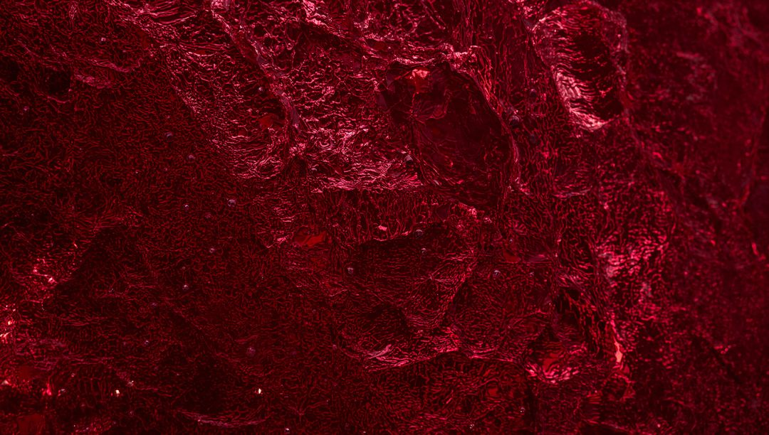 Crimson Macro Texture Showing Glossy Ridged Surface with Deep Burgundy Crevices and Sheen