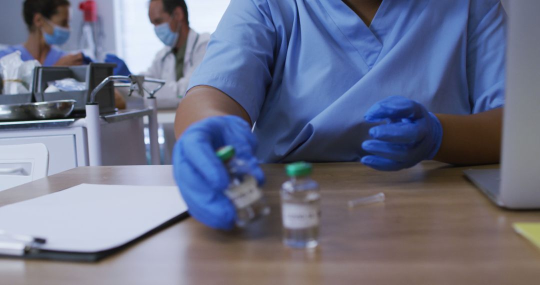 Healthcare Professional Preparing Vaccine Doses in Medical Office - Free Images, Stock Photos and Pictures on Pikwizard.com