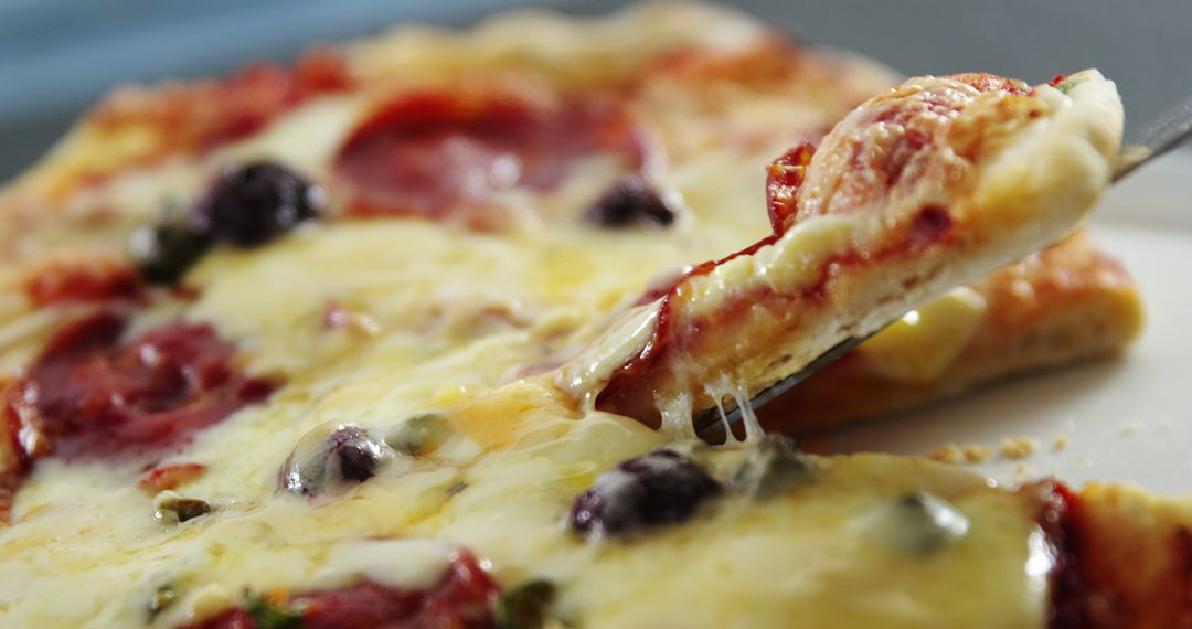 Close-up of Delicious Pepperoni Pizza Slice with Gooey Cheese - Free Images, Stock Photos and Pictures on Pikwizard.com