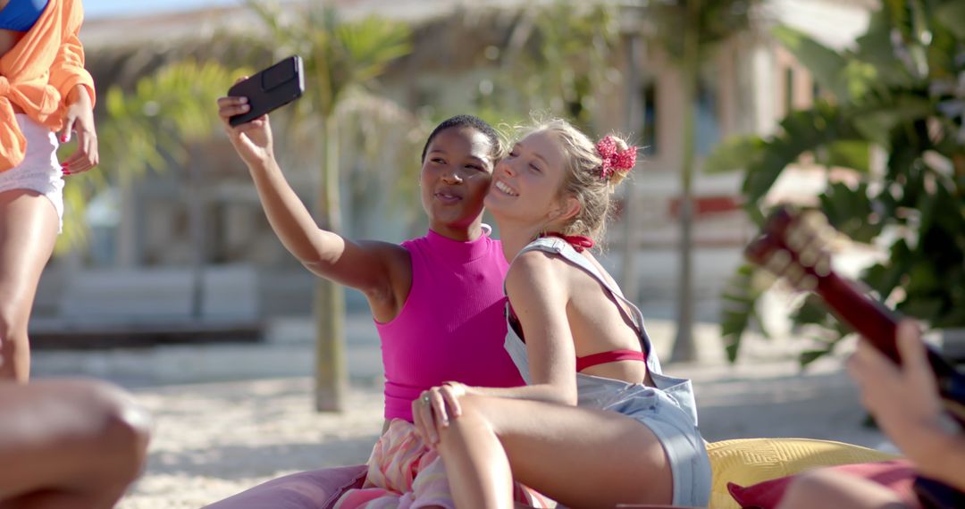 Friends Taking Selfies at Tropical Beach Resort - Free Images, Stock Photos and Pictures on Pikwizard.com