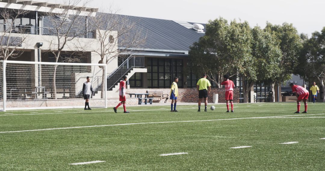 Soccer Players Strategizing During Practice Session