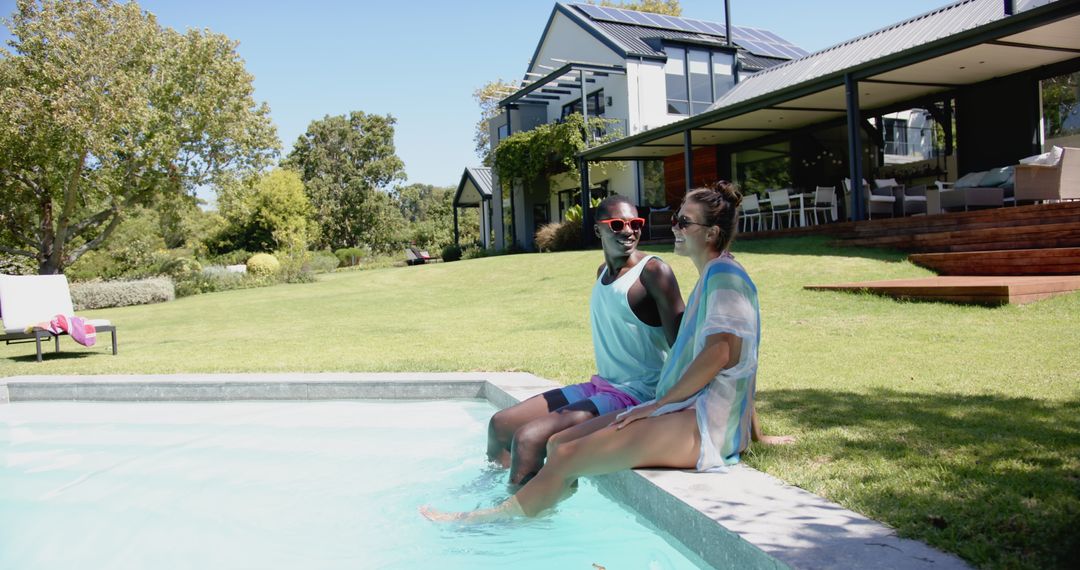 Couple Relaxing by Pool in Luxury Modern House Garden