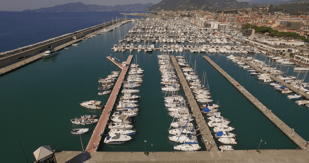 Aerial View of Transparent Blue Harbor with Boats and Yachts