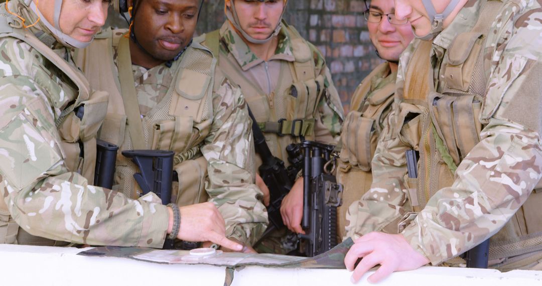 Military Team in Camouflage Uniforms Analyzing Map for Mission Planning - Free Images, Stock Photos and Pictures on Pikwizard.com