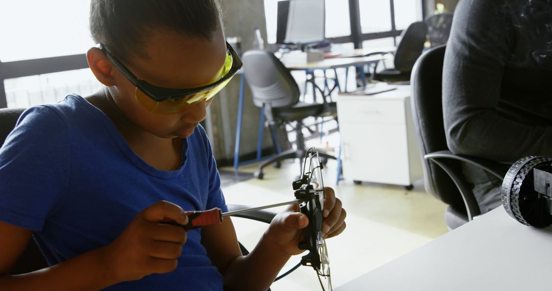 Focused Child Building Robotics Project in Modern Classroom - Free Images, Stock Photos and Pictures on Pikwizard.com