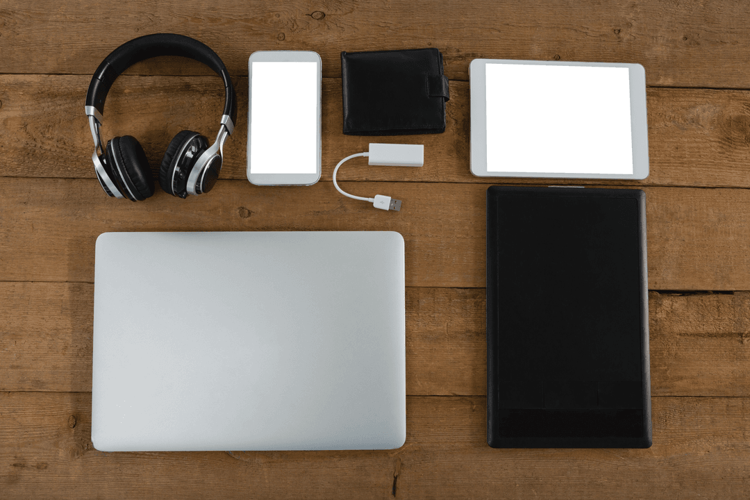 Collection of Transparent Electronics on Rustic Wooden Surface
