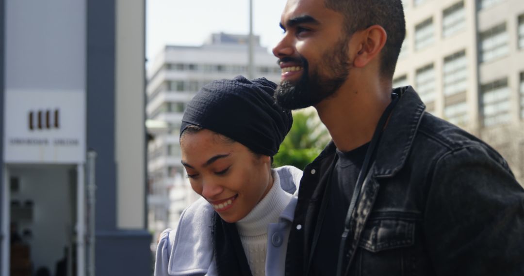 Joyful Couple Walking in Urban Environment Embracing Happiness
